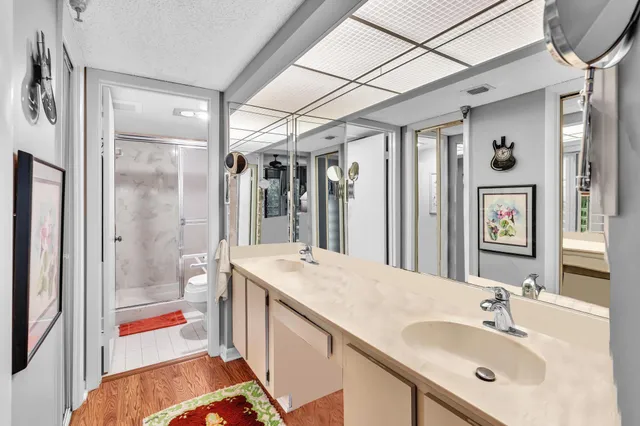 a bathroom with a sink double vanity and a mirror