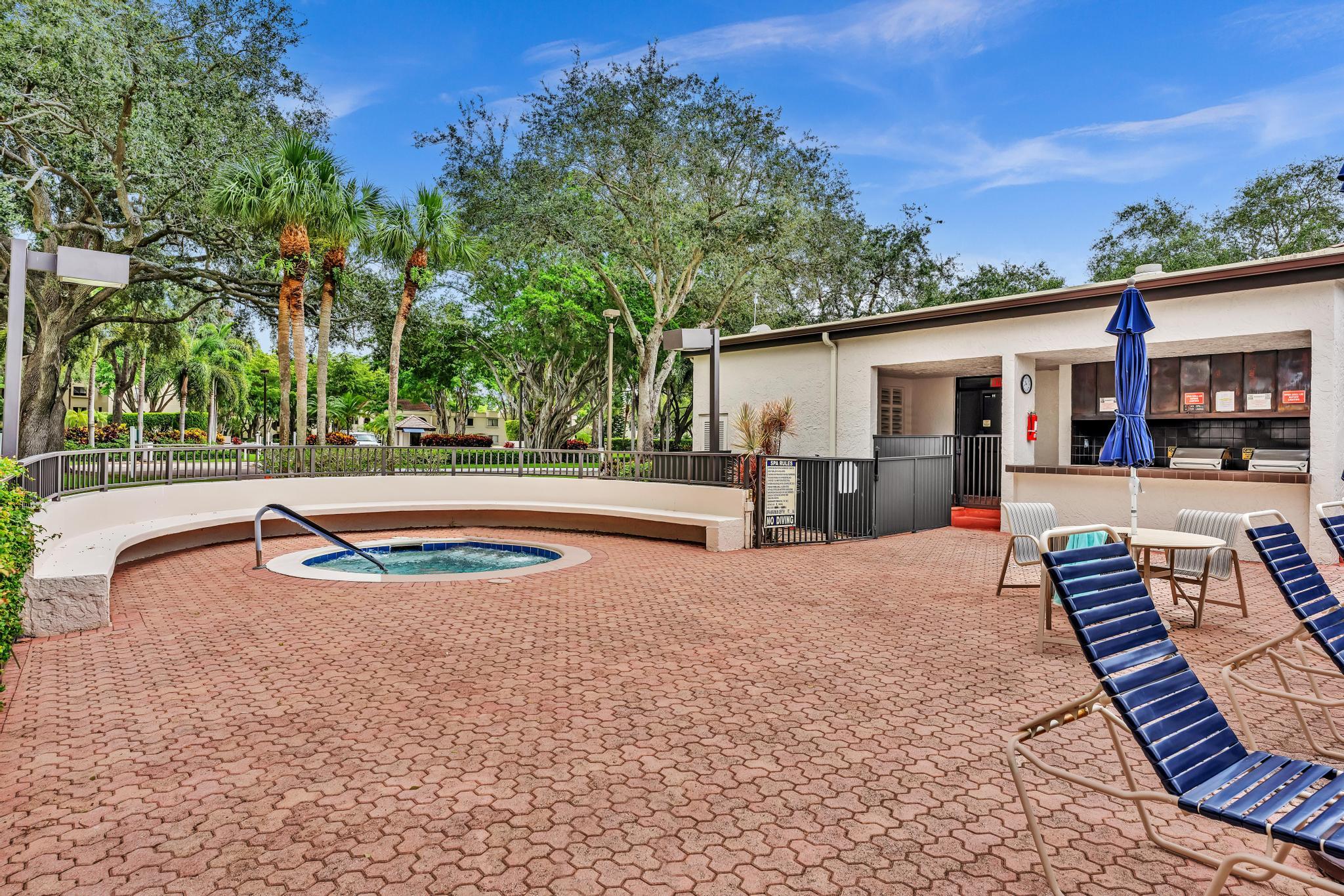 6320 Boca Del Mar Drive, Unit 303 Boca Raton, FL 33433 - Photo 35 of 42 a view of a backyard with a patio