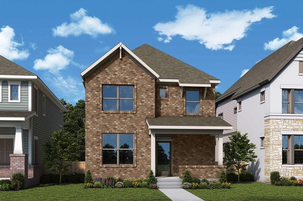 View of front facade featuring brick siding and a front yard