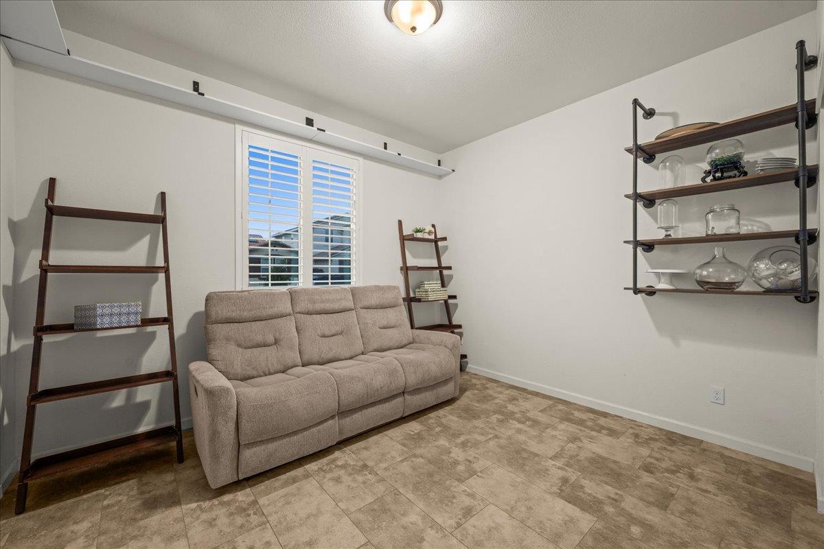 12791 Evanston Way Rancho Cordova, CA 95742 - Photo 11 of 54 This bedroom / room is downstairs with a full closet, windows adorned with custom shutters and accent display shelf.