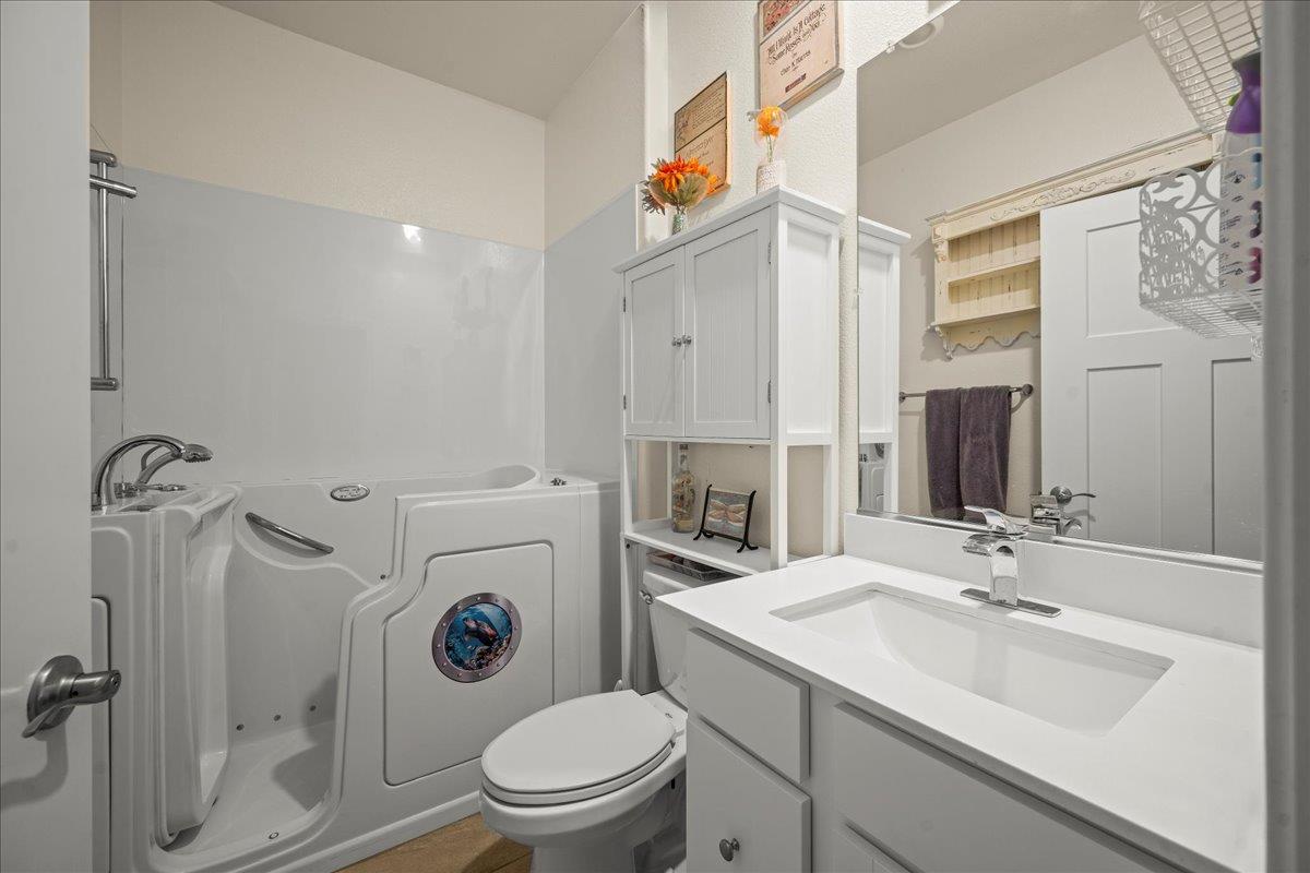 12791 Evanston Way Rancho Cordova, CA 95742 - Photo 13 of 54 a bathroom with a sink a toilet and shower