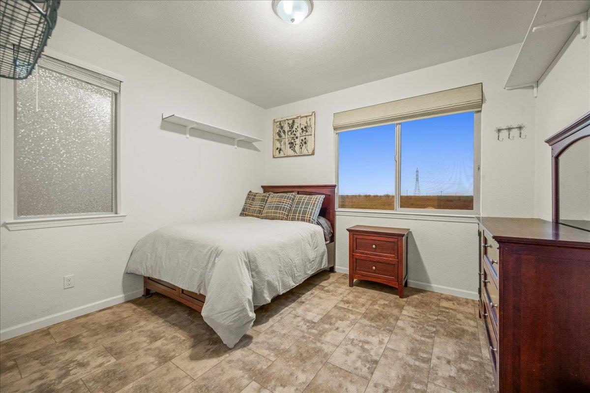 12791 Evanston Way Rancho Cordova, CA 95742 - Photo 25 of 54 a spacious bedroom with a bed and a dresser