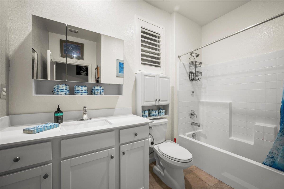 12791 Evanston Way Rancho Cordova, CA 95742 - Photo 26 of 54 a bathroom with a double vanity sink toilet and shower
