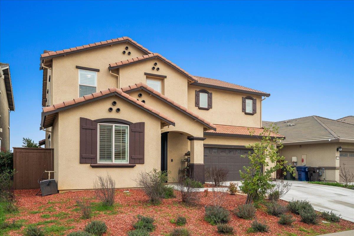12791 Evanston Way Rancho Cordova, CA 95742 - Photo 31 of 54 a front view of a house with a yard