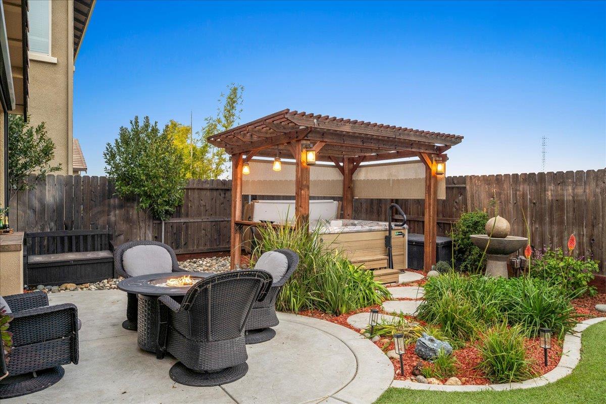 12791 Evanston Way Rancho Cordova, CA 95742 - Photo 34 of 54 a patio with a table and chairs and potted plants
