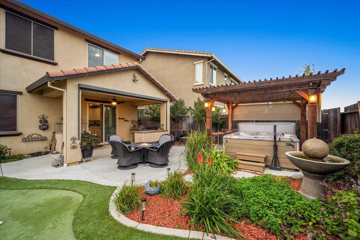 12791 Evanston Way Rancho Cordova, CA 95742 - Photo 35 of 54 a view of a house with backyard porch and sitting area