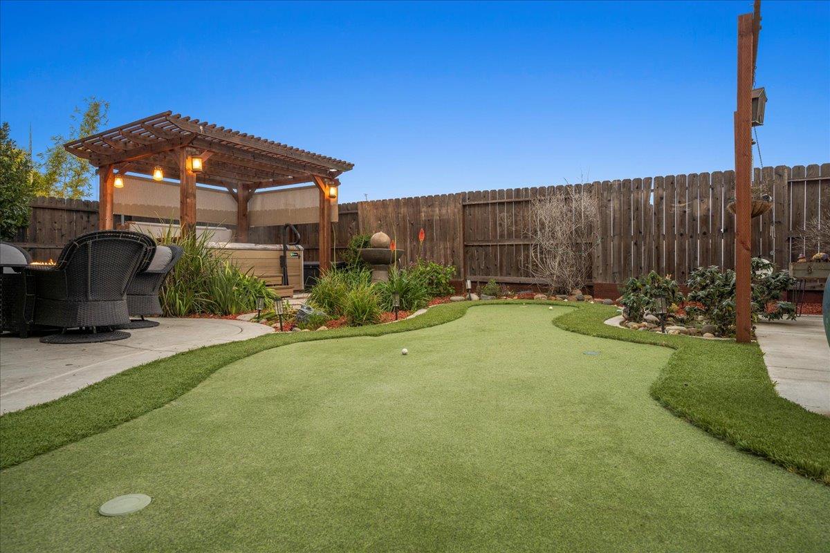 12791 Evanston Way Rancho Cordova, CA 95742 - Photo 40 of 54 Upgraded outdoor lighting that is operated by a phone app. LOOK at this putting green! FORE!!