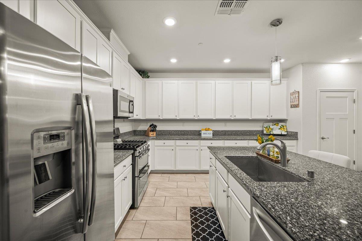 12791 Evanston Way Rancho Cordova, CA 95742 - Photo 45 of 54 Stainless steel appliances and LOOK at ALL the CABINETS... PLUS a PANTRY!