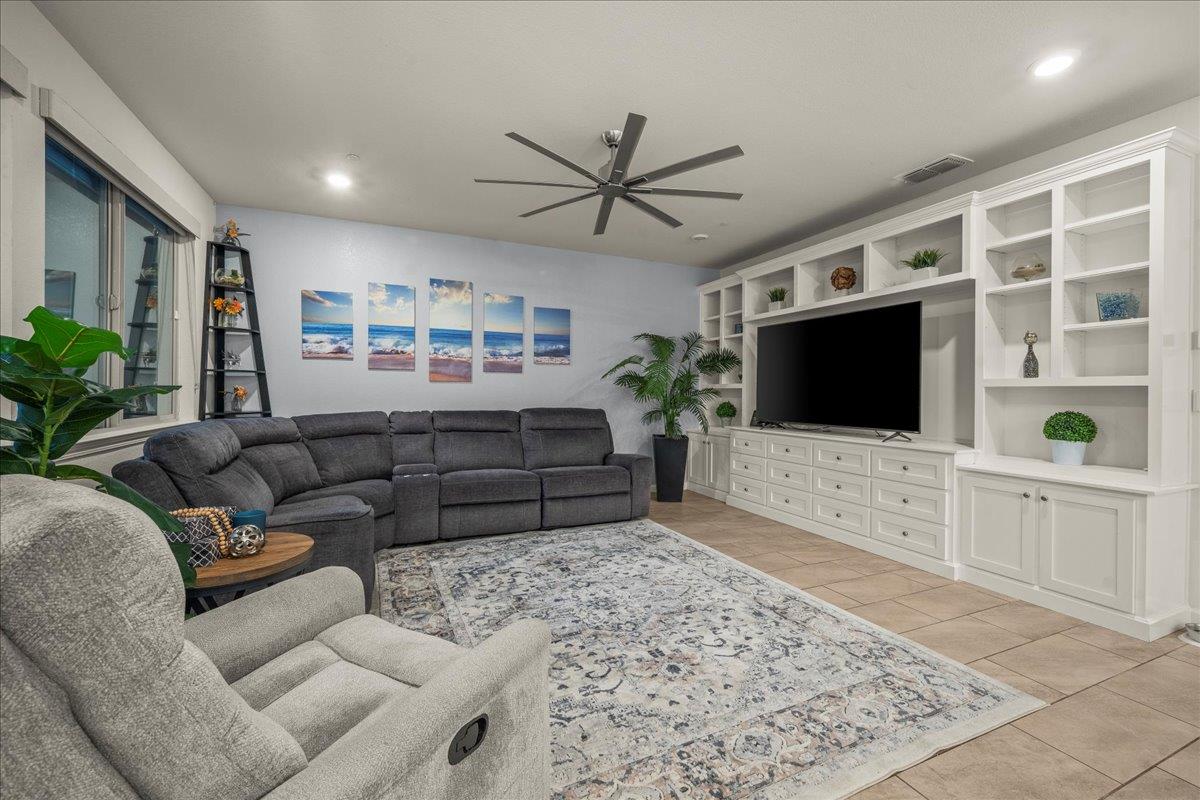 12791 Evanston Way Rancho Cordova, CA 95742 - Photo 49 of 54 LOOK at the size of this custom built wall unit with storage shelves that can be adjusted and hosts a LARGE TV and LOTS of drawers for games, blankets, ect.