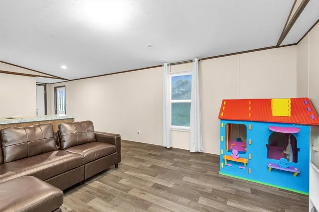 a living room with furniture and a couch