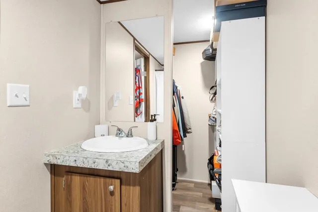 a bathroom with a sink and a mirror