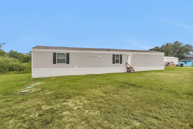 a front view of house with yard and seating area