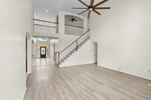 a view of an entryway with wooden floor