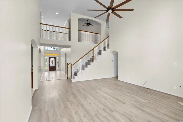 a view of an entryway with wooden floor