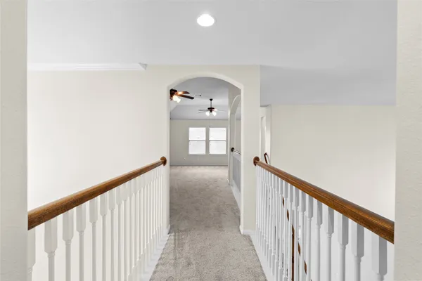 a view of a hallway view with staircase