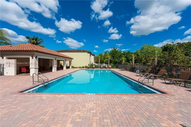 a view of a house with swimming pool