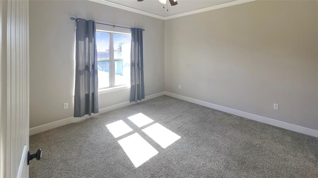 5765 Abbey Road Abilene, TX 79606 - Photo 8 of 11 an empty room with windows