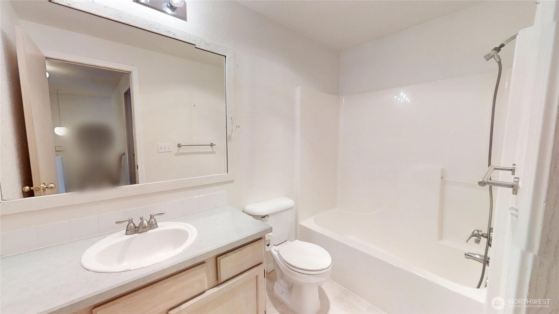 6039 Merlot Lane Southeast Lacey, WA 98513 - Photo 14 of 21 a bathroom with a sink and a mirror