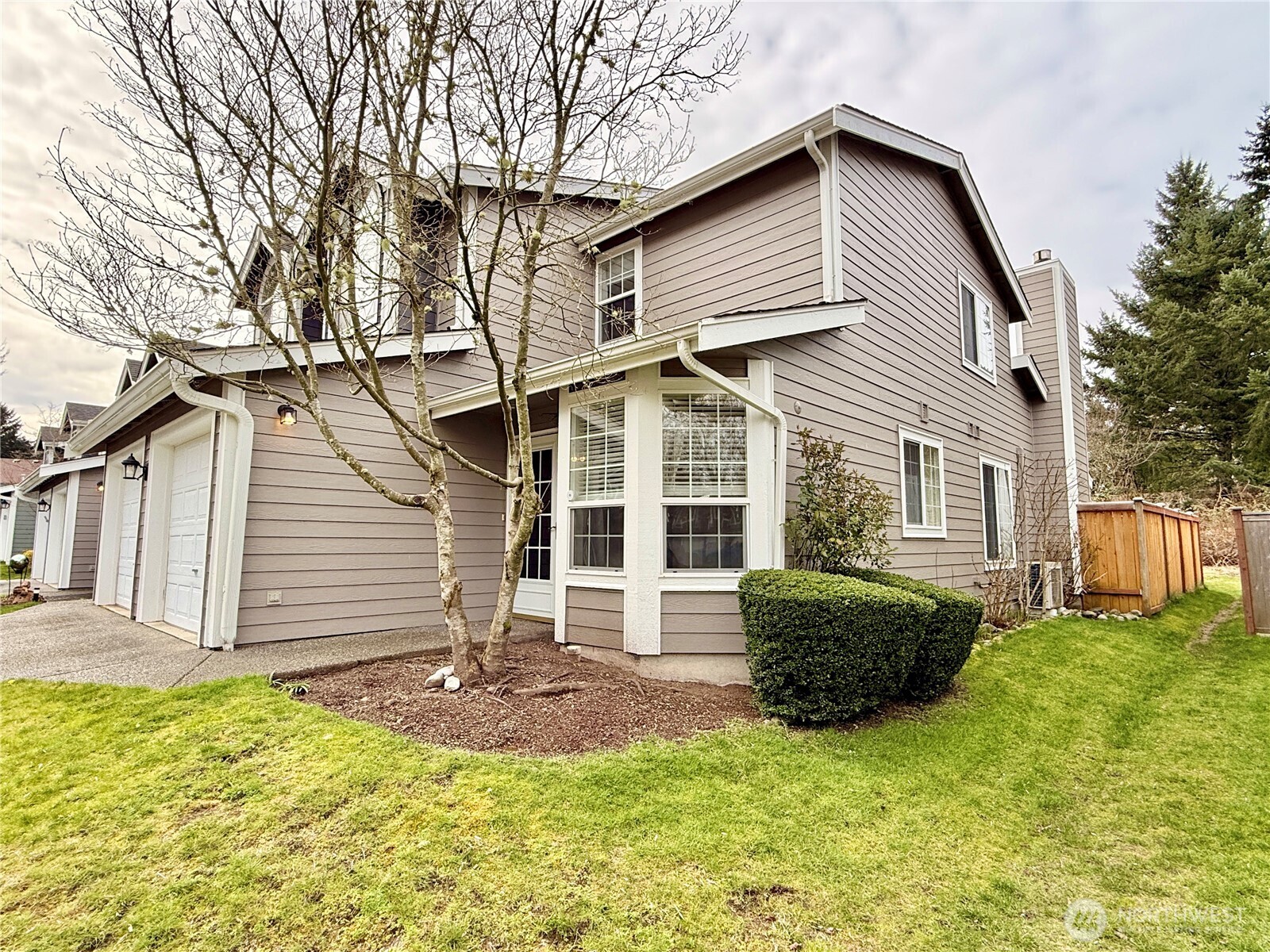 6039 Merlot Lane Southeast Lacey, WA 98513 - Photo 21 of 21 a front view of a house with a yard and garage