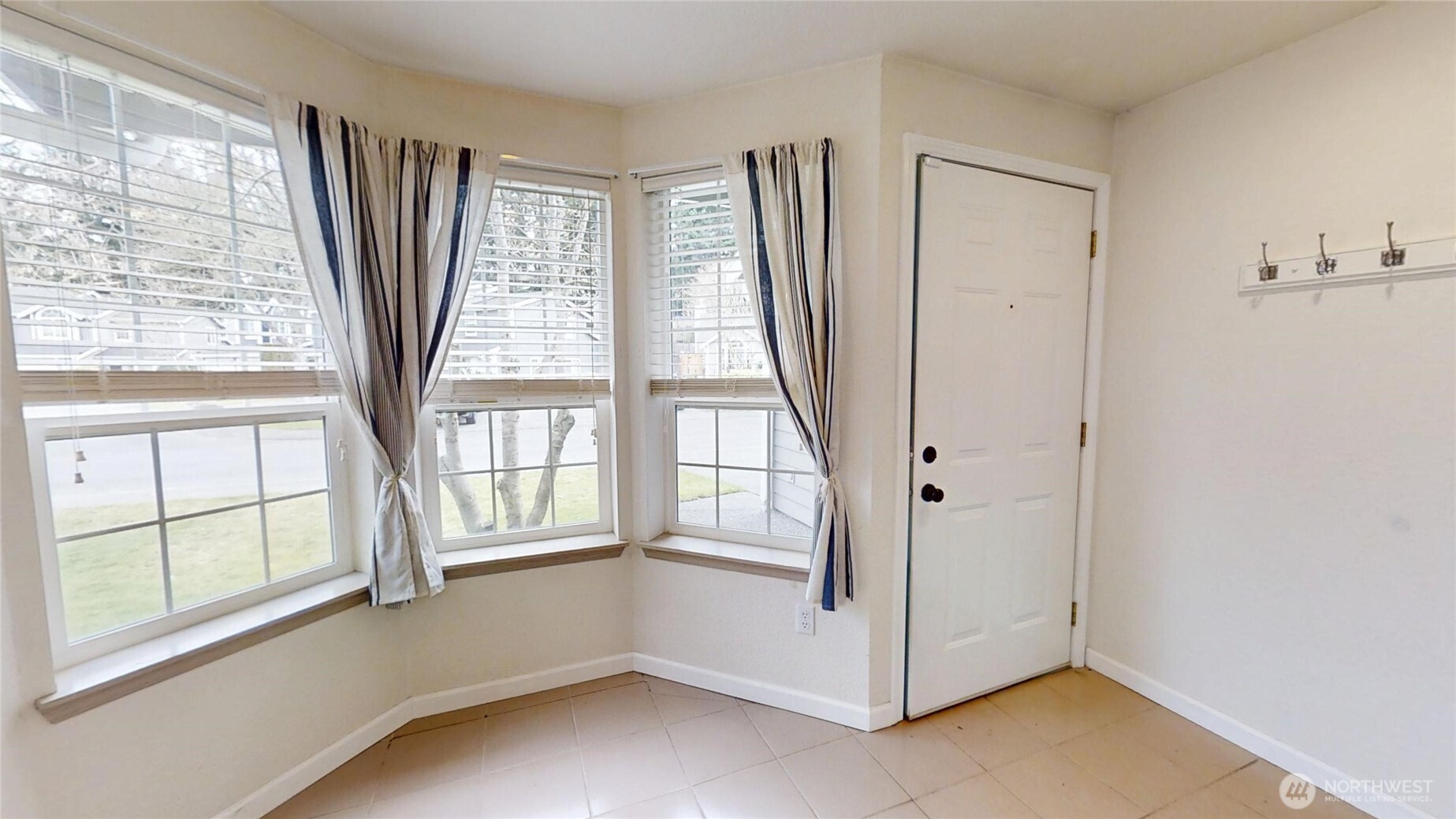 6039 Merlot Lane Southeast Lacey, WA 98513 - Photo 3 of 21 a view of a large window with an empty room