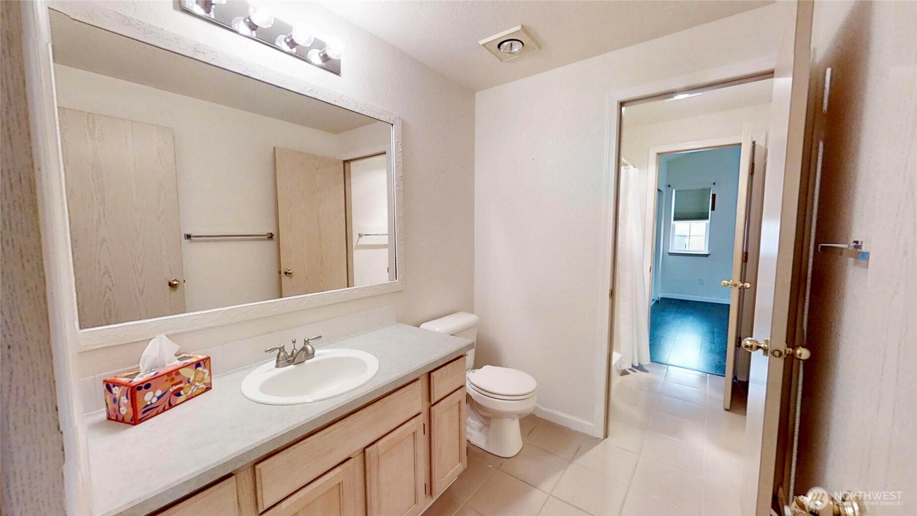 6039 Merlot Lane Southeast Lacey, WA 98513 - Photo 10 of 21 a bathroom with a sink a toilet and shower