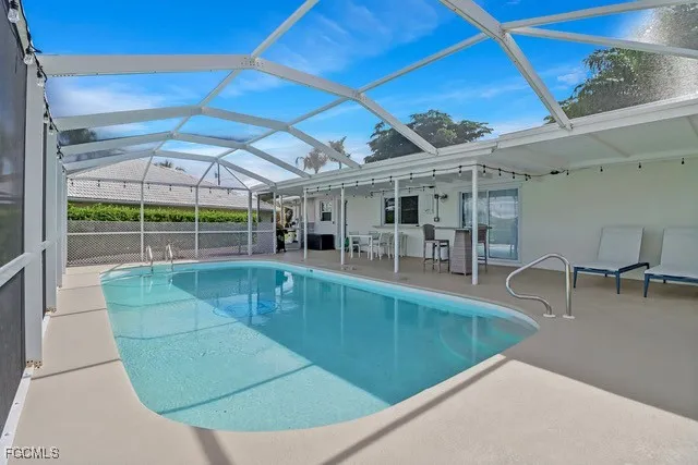 a view of a swimming pool with a patio