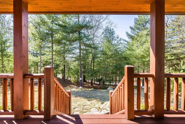 a kitchen with granite countertop kitchen island stainless steel appliances a stove refrigerator and a sink