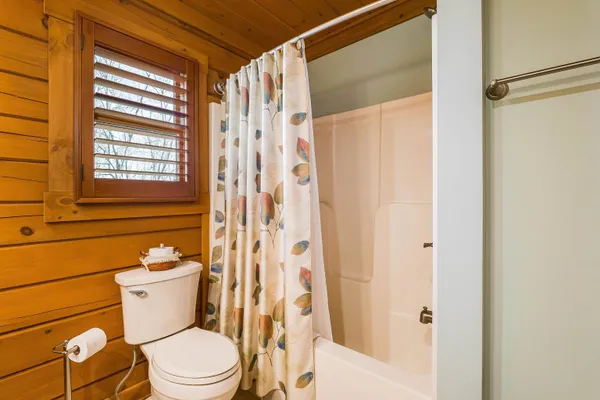 a view of a house with a yard covered in snow