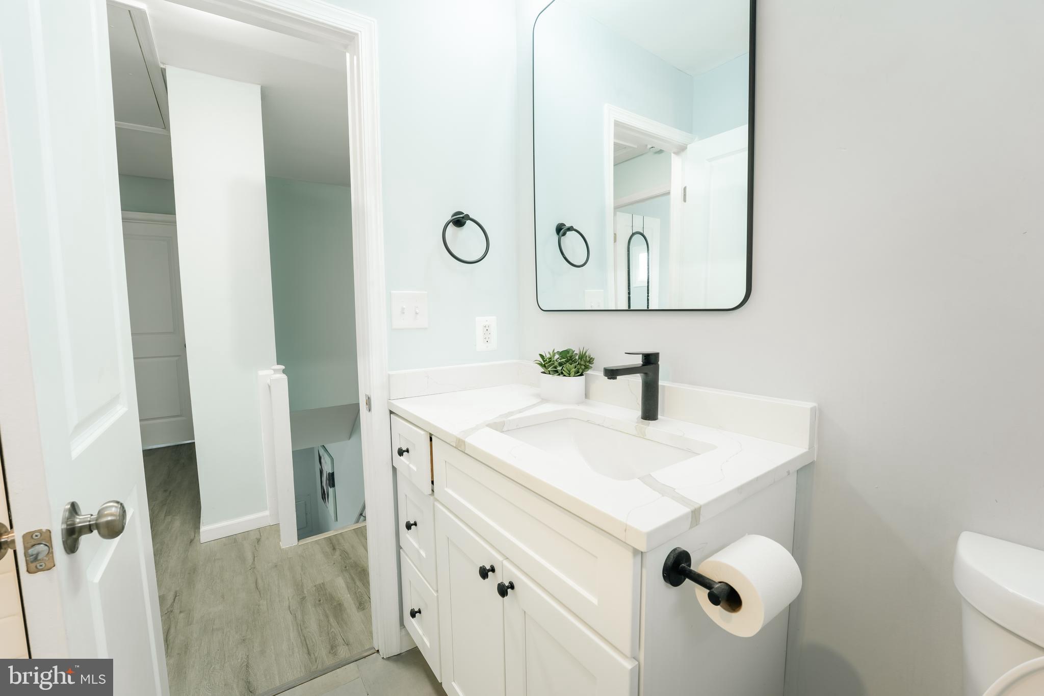 3410 Embry Street Silver Spring, MD 20902 - Photo 13 of 28 a bathroom with a sink vanity and a mirror