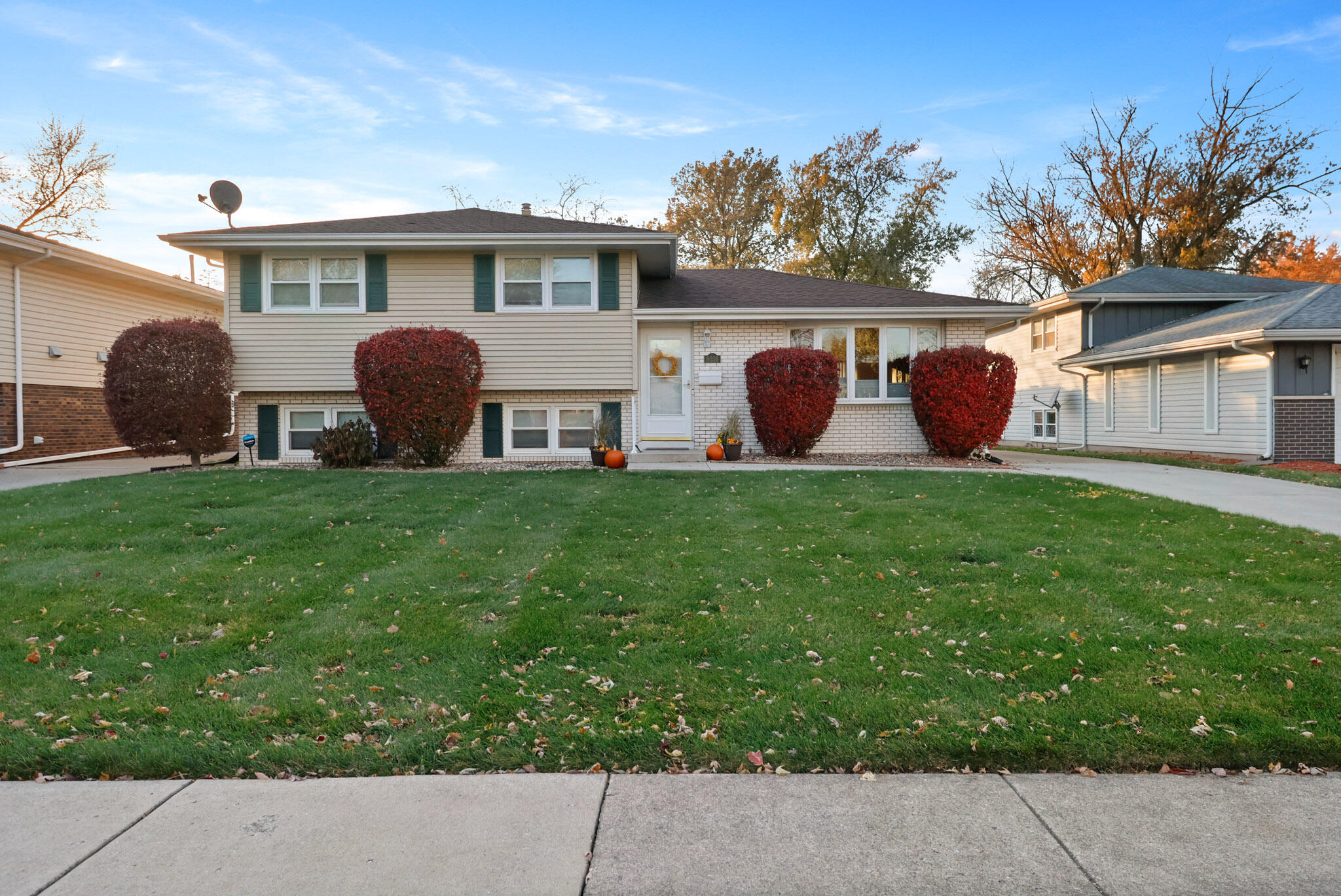 a view of a house with backyard porch and sitting area