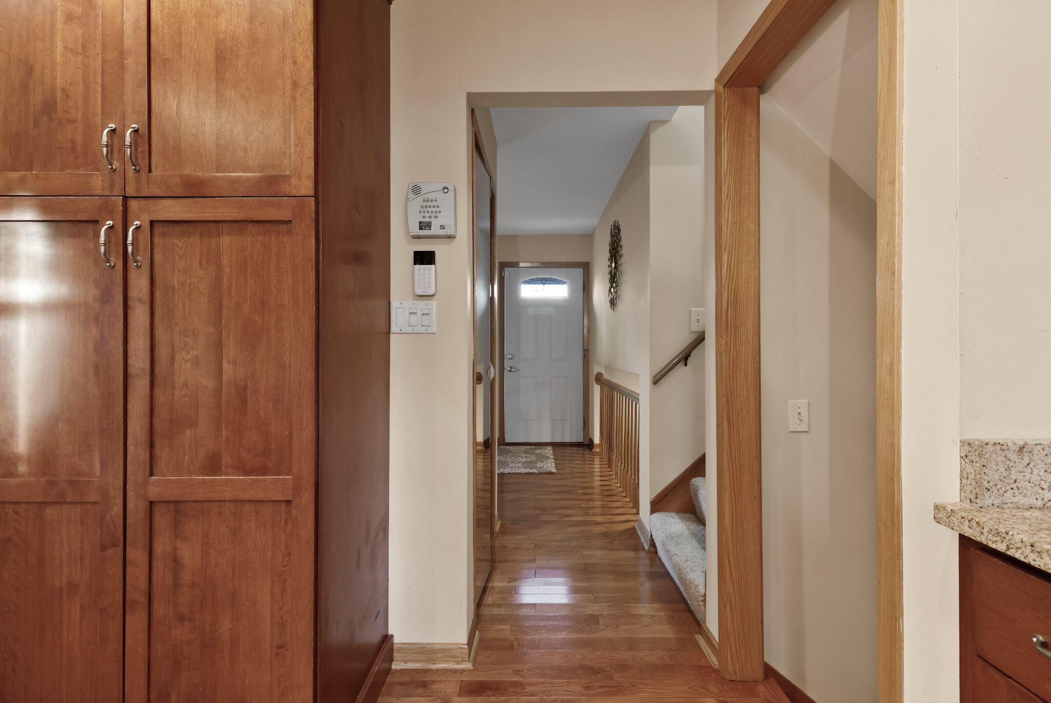 8036 Beech Avenue Munster, IN 46321 - Photo 12 of 28 a view of a hallway with a wooden floor