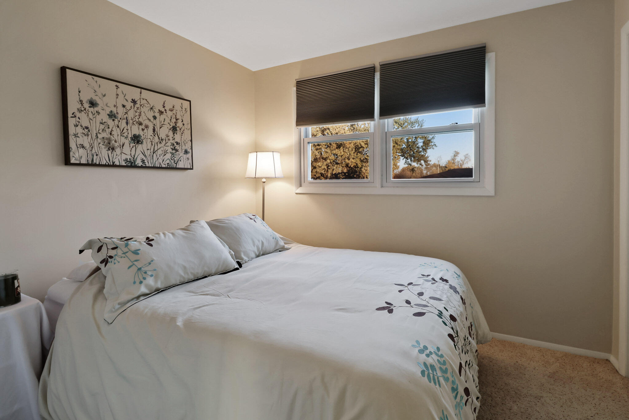 8036 Beech Avenue Munster, IN 46321 - Photo 14 of 28 a large bed sitting in a bedroom next to a window