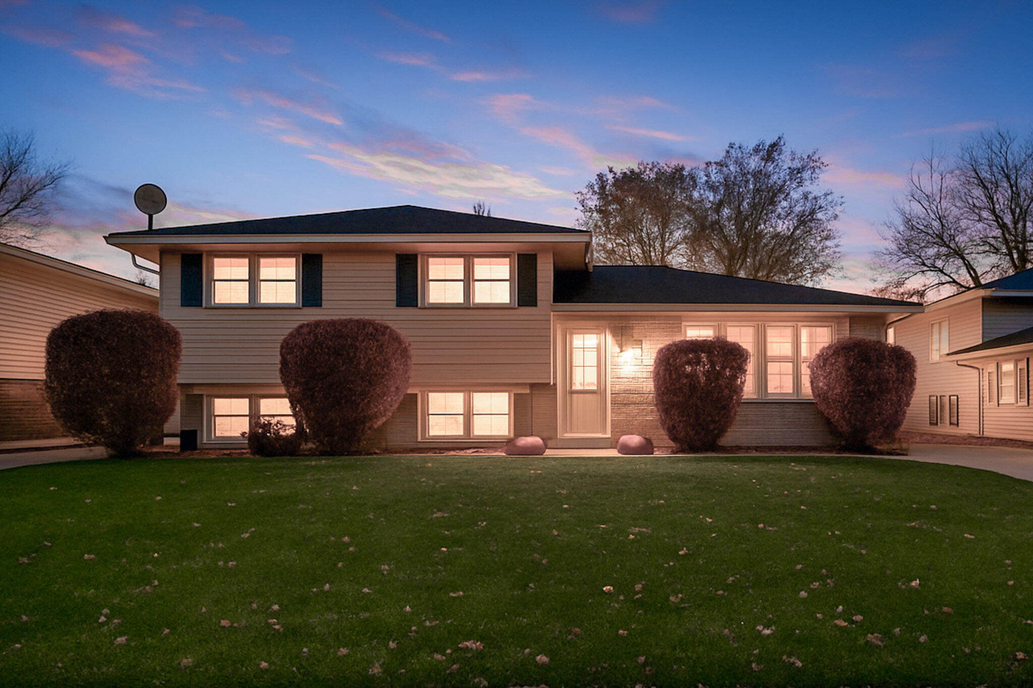 8036 Beech Avenue Munster, IN 46321 - Photo 28 of 28 a front view of house with yard and outdoor seating