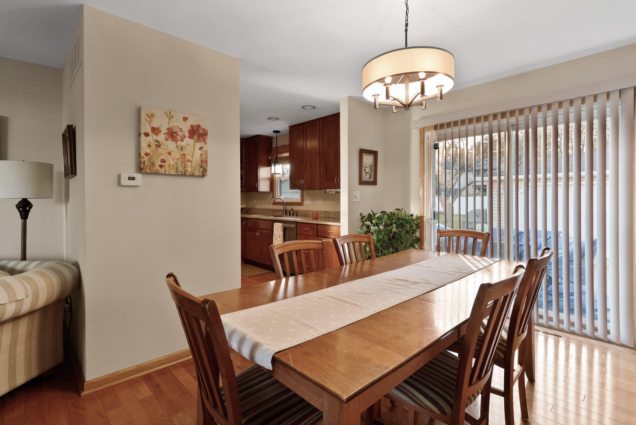 8036 Beech Avenue Munster, IN 46321 - Photo 5 of 28 a view of a dining room with furniture and wooden floor