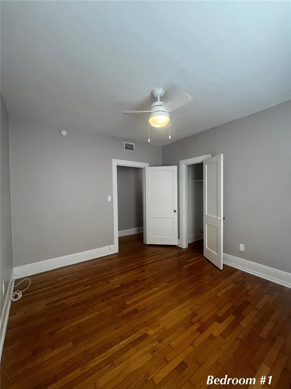 3303 West Empedrado Street, Unit 4 Tampa, FL 33629 - Photo 11 of 16 an empty room with wooden floor and window