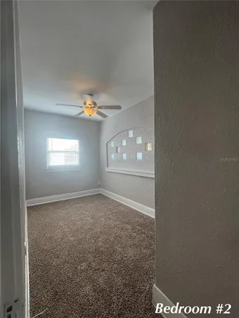 a view of an empty room with a window