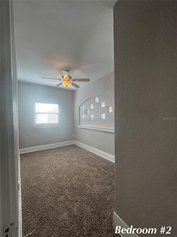 3303 West Empedrado Street, Unit 4 Tampa, FL 33629 - Photo 14 of 16 a view of an empty room with a window