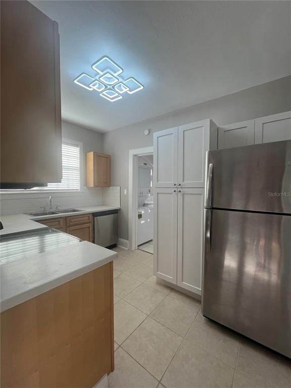 3303 West Empedrado Street, Unit 4 Tampa, FL 33629 - Photo 7 of 16 a kitchen with stainless steel appliances granite countertop a refrigerator a stove a sink and a refrigerator