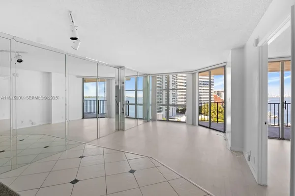 a view of an empty room with a window