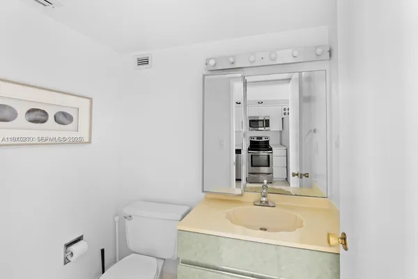 a bathroom with a sink and a toilet