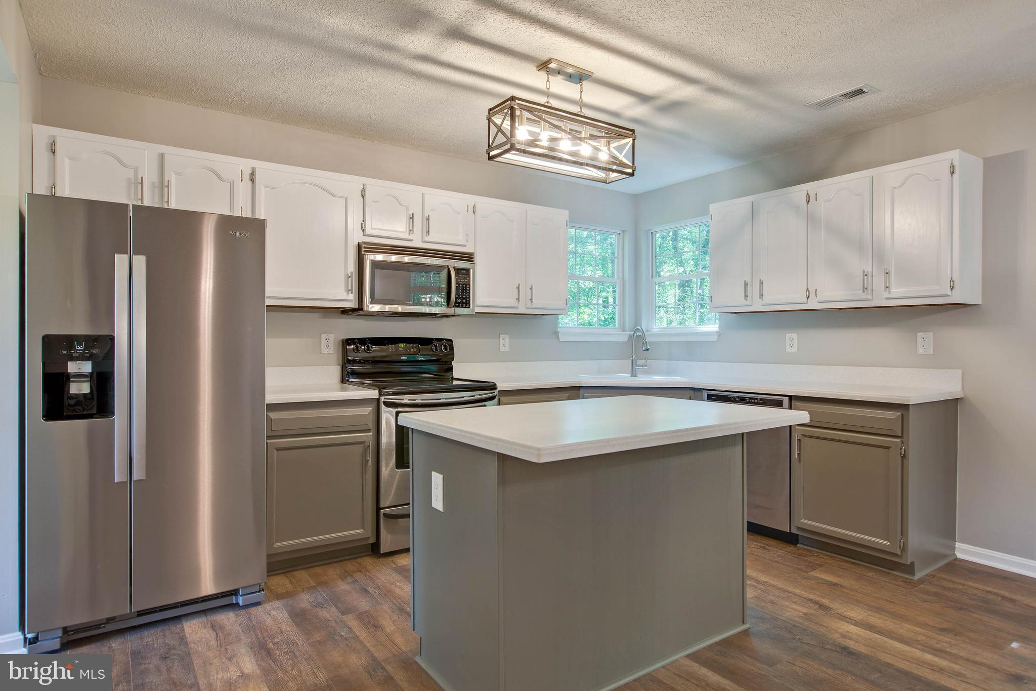 37799 Apache Road Charlotte Hall, MD 20622 - Photo 6 of 23 Stainless Steel appliance, Corian counter tops