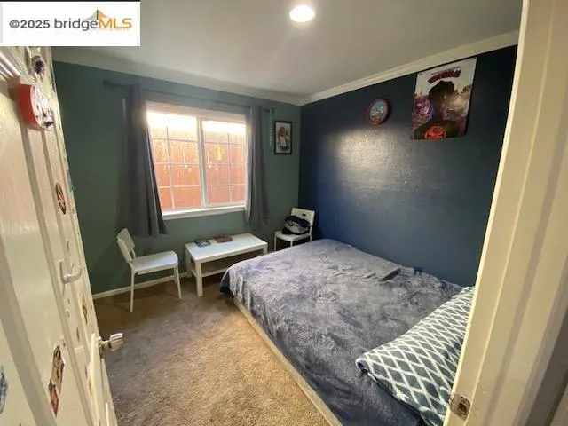 a bathroom with a granite countertop bathtub shower sink vanity and toilet