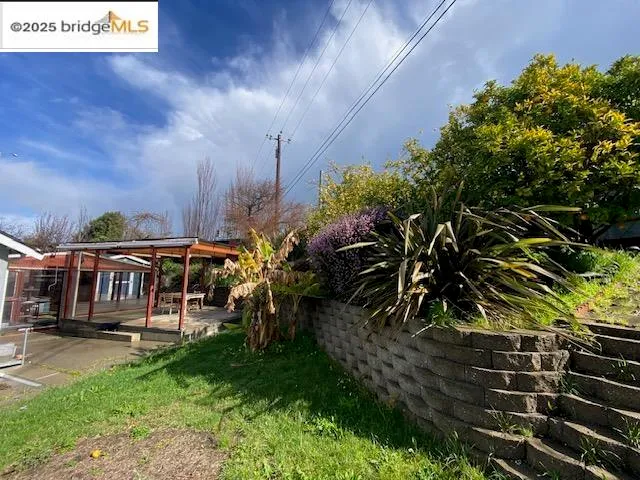 a view of a chairs and table in the patio