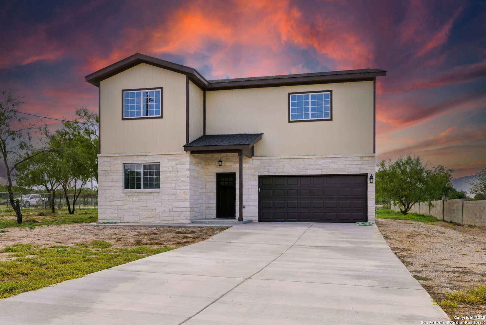 a front view of a house with yard