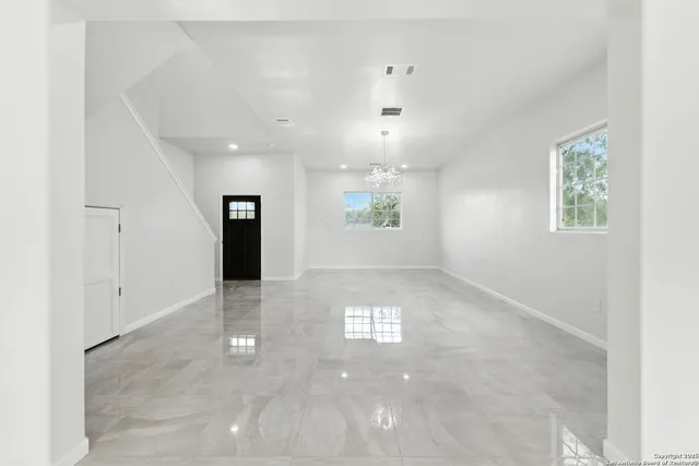 a view of an empty room with a window