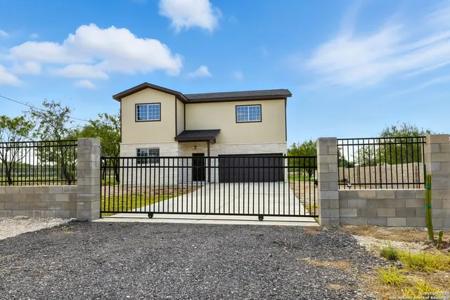 a view of a wrought iron fences in front of house