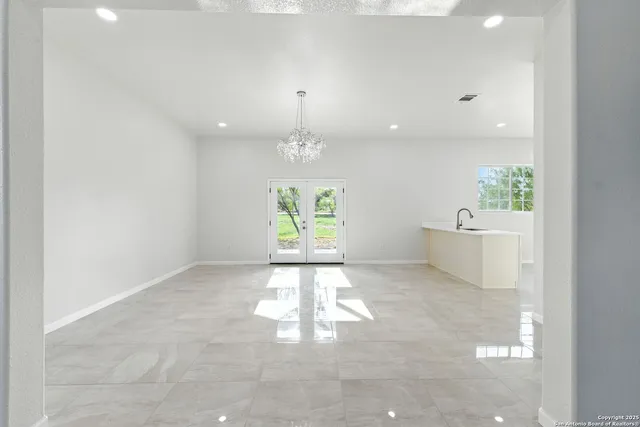 a stove top oven sitting inside of a kitchen