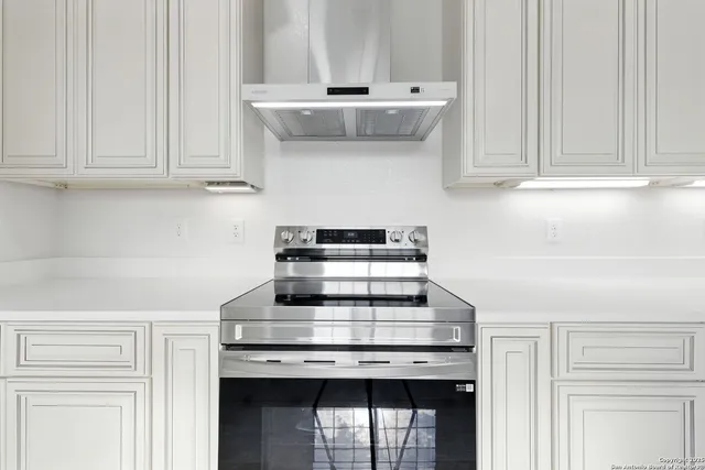 a kitchen with a sink and a window