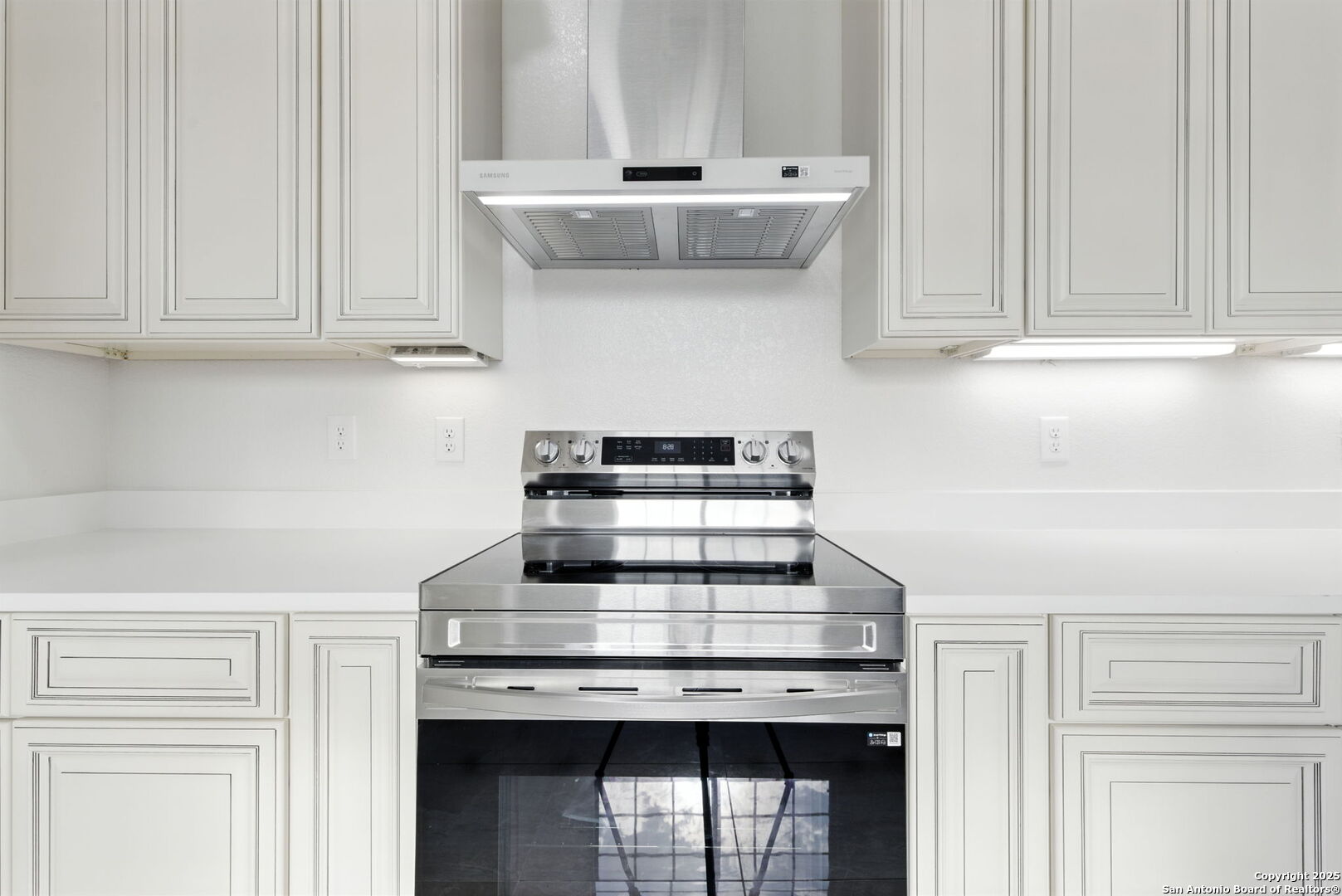 774 County Road 6843 Lytle, TX 78052 - Photo 27 of 63 a stove top oven sitting inside of a kitchen