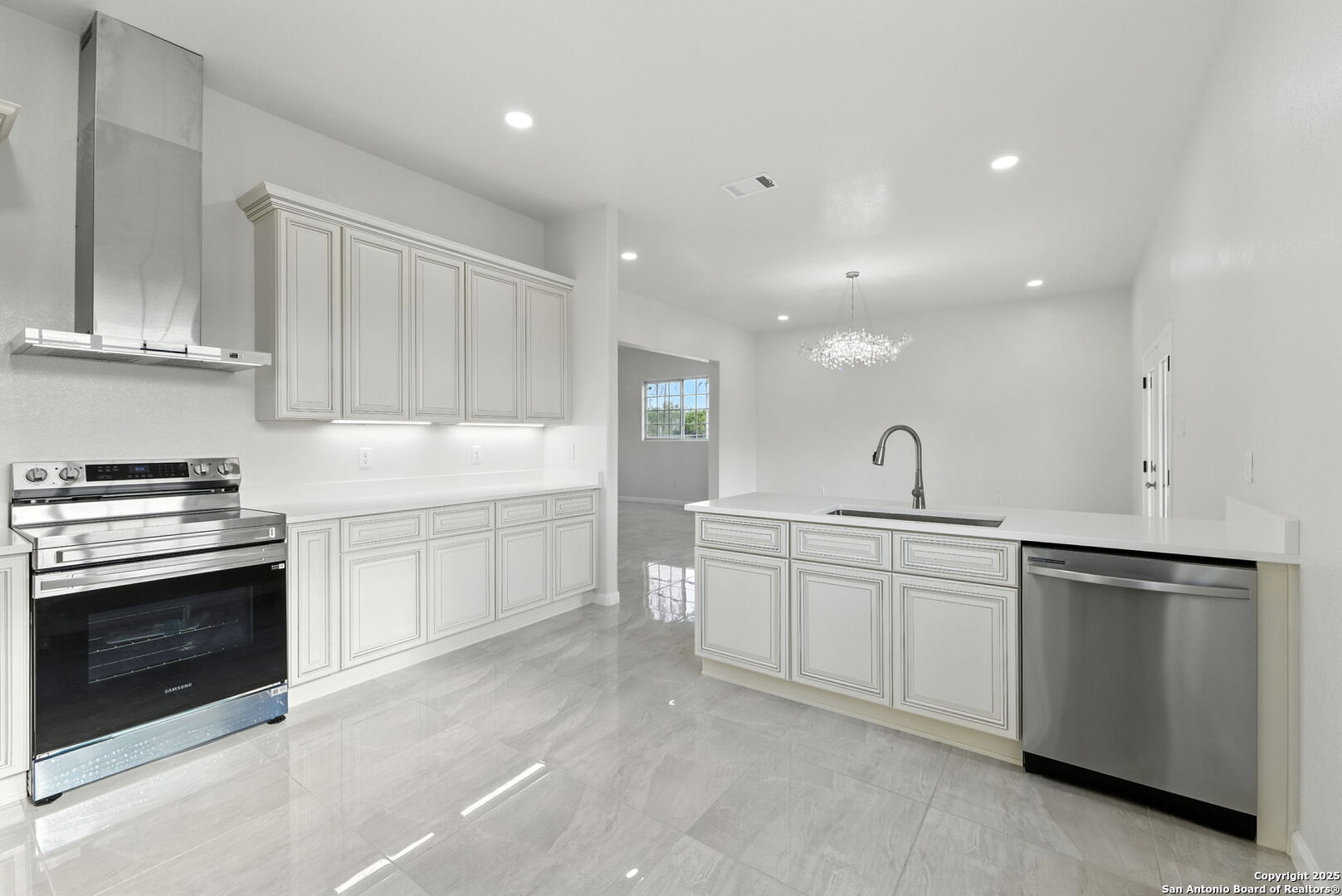 774 County Road 6843 Lytle, TX 78052 - Photo 29 of 63 a kitchen with white cabinets stainless steel appliances and a sink